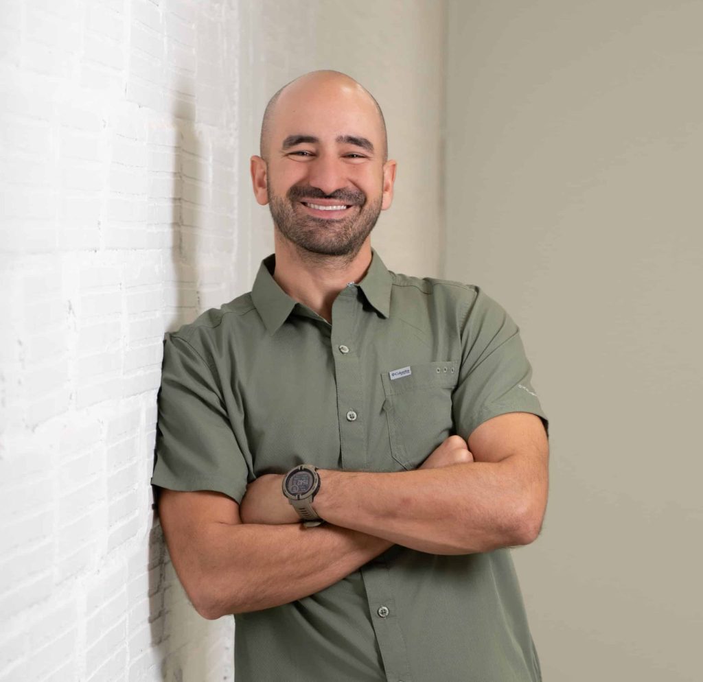 Empowered professional smiling with arms crossed, promoting Prosperity CD for financial growth and success.